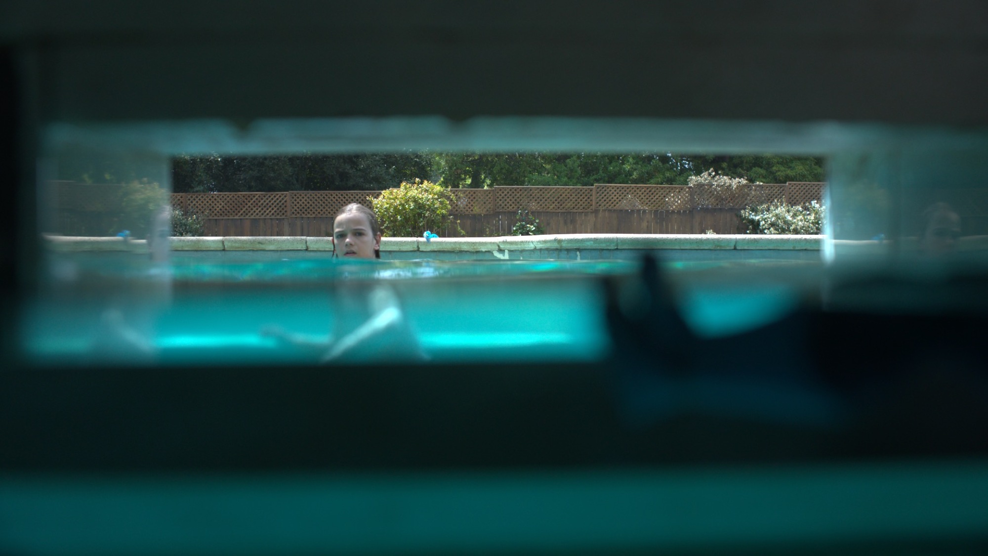 Shot of swimming pool through the pool filter.