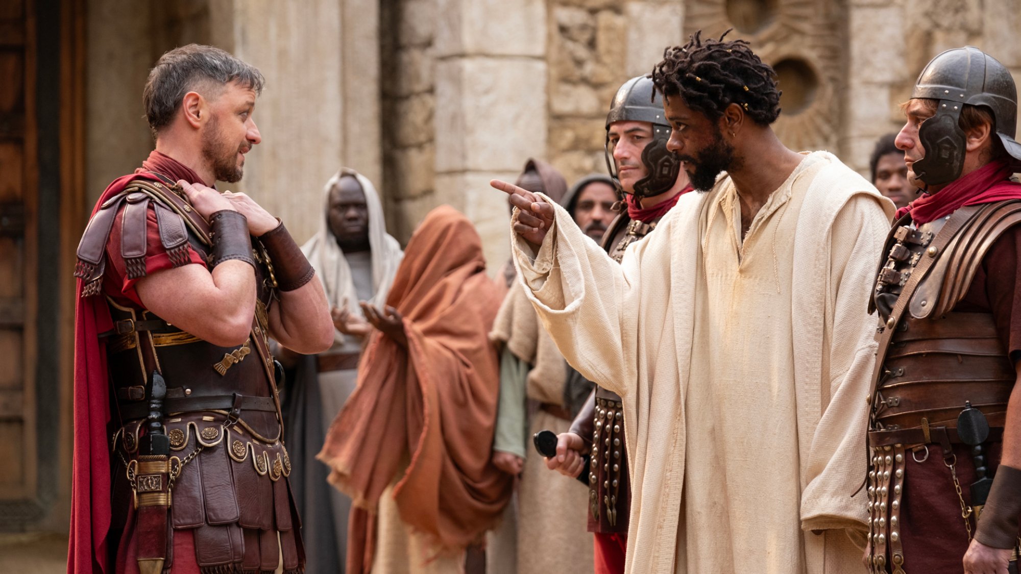 A Roman governor and a man have a standoff in a crowd.