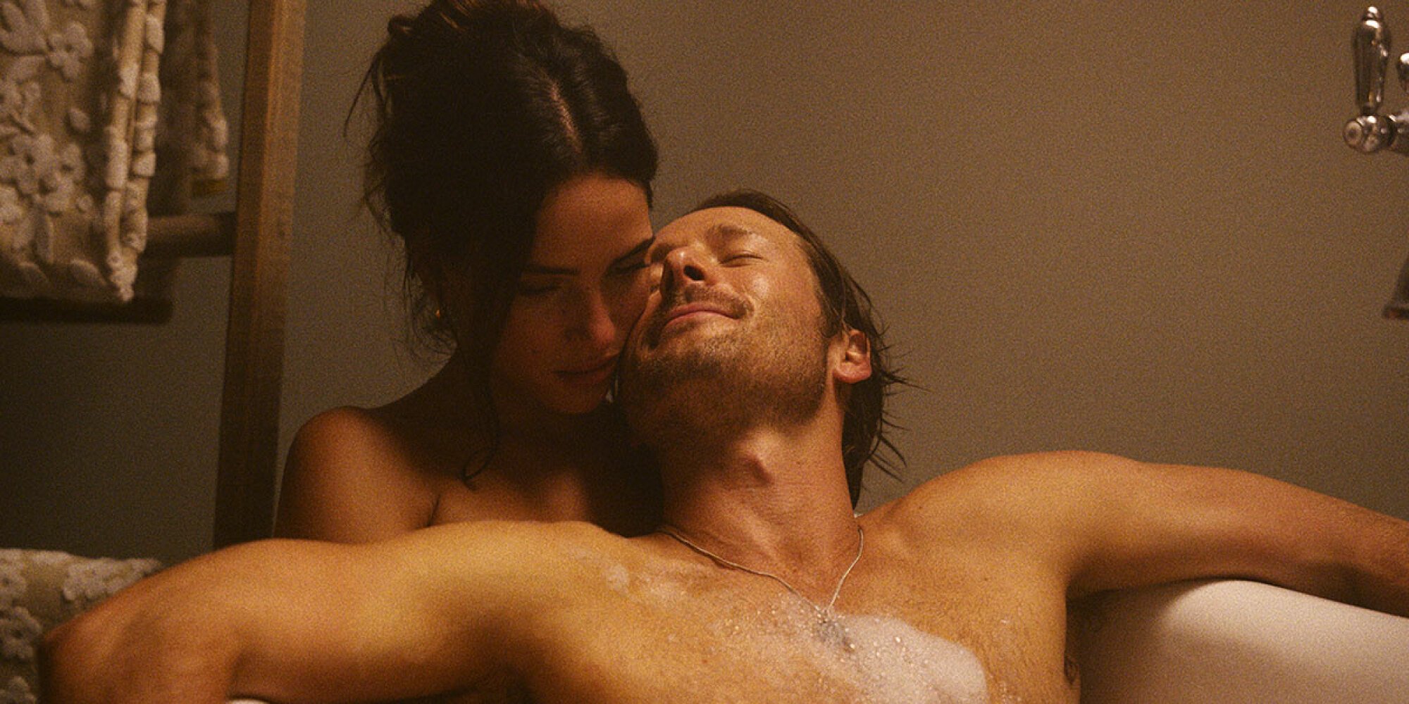 Adria Arjona and Glen Powell in "Hit Man."