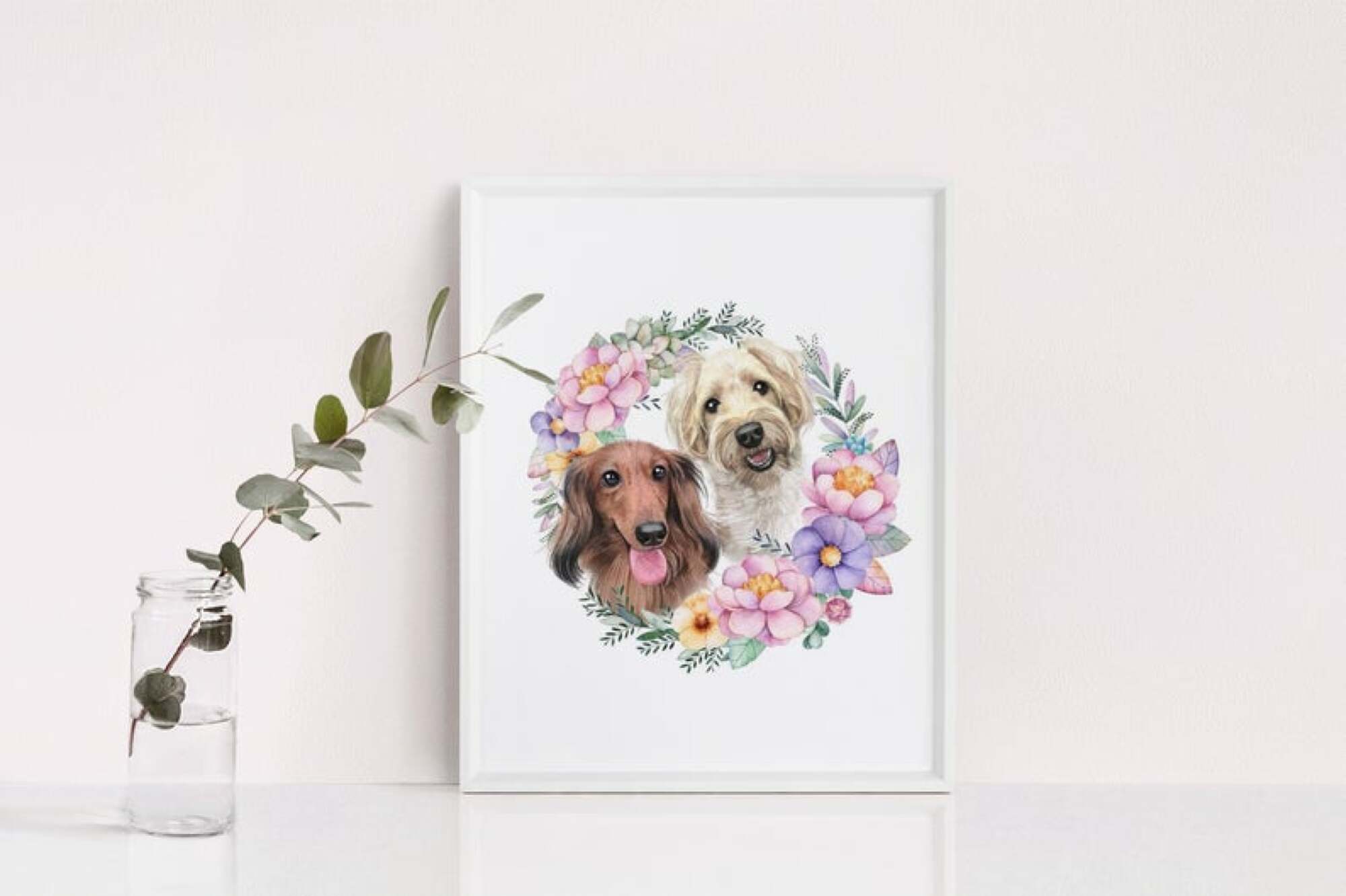 custom painting of dogs next to a glass with a plant