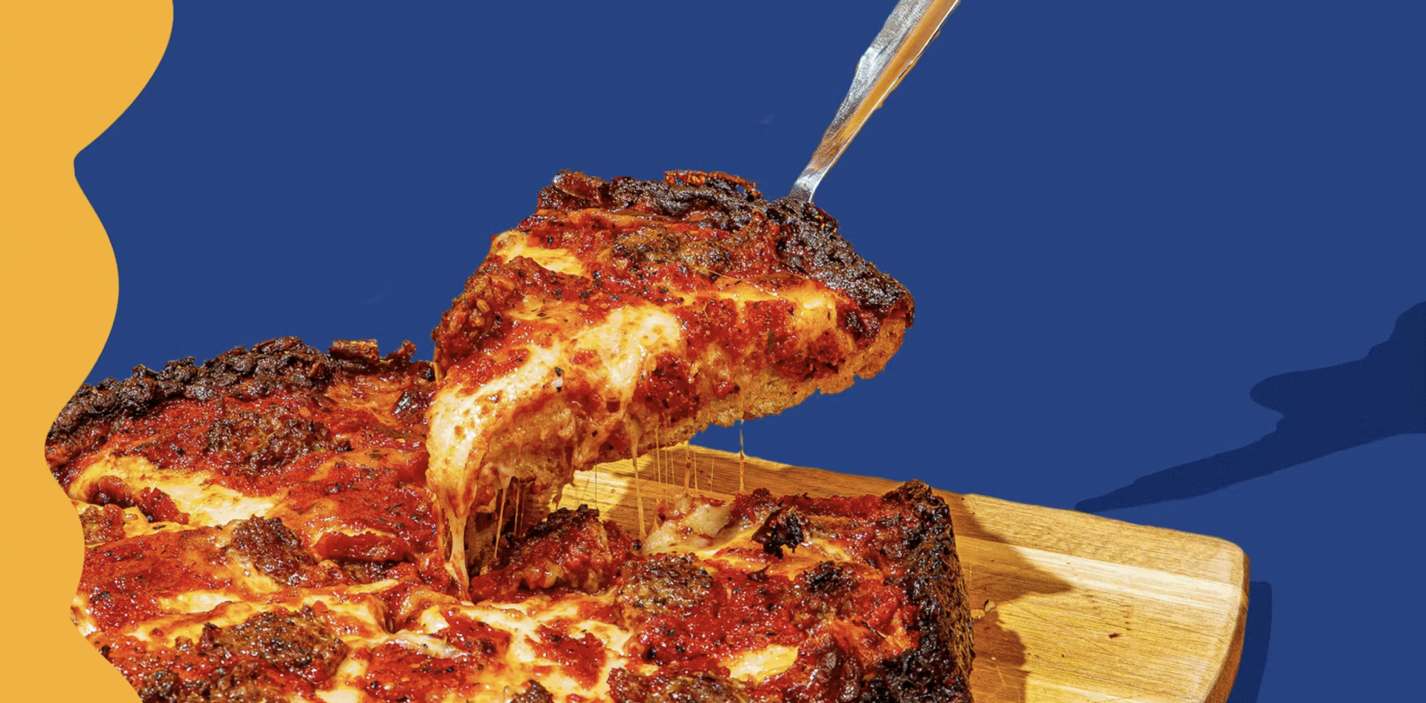 Spatula removing a piece of pizza from a whole pizza