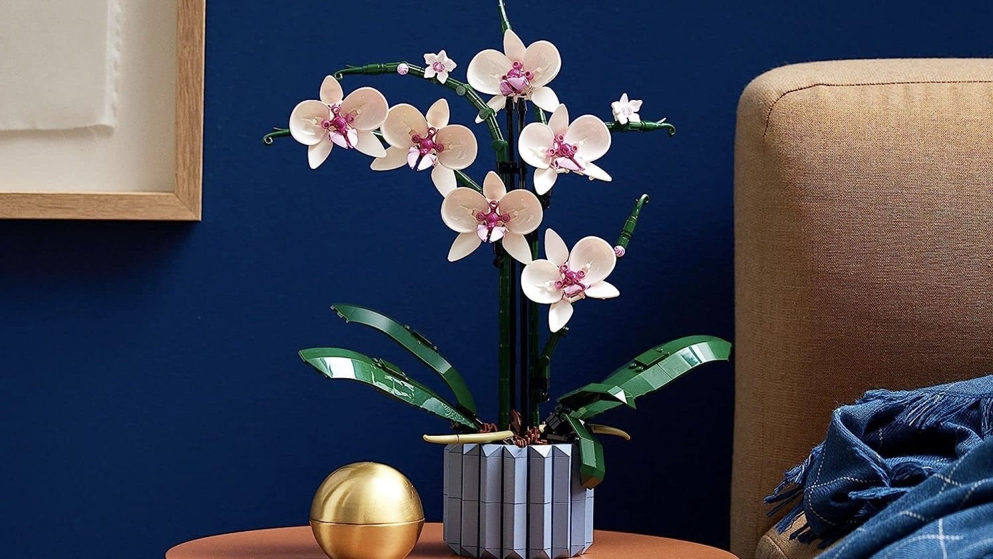 lego orchid on bedroom nightstand