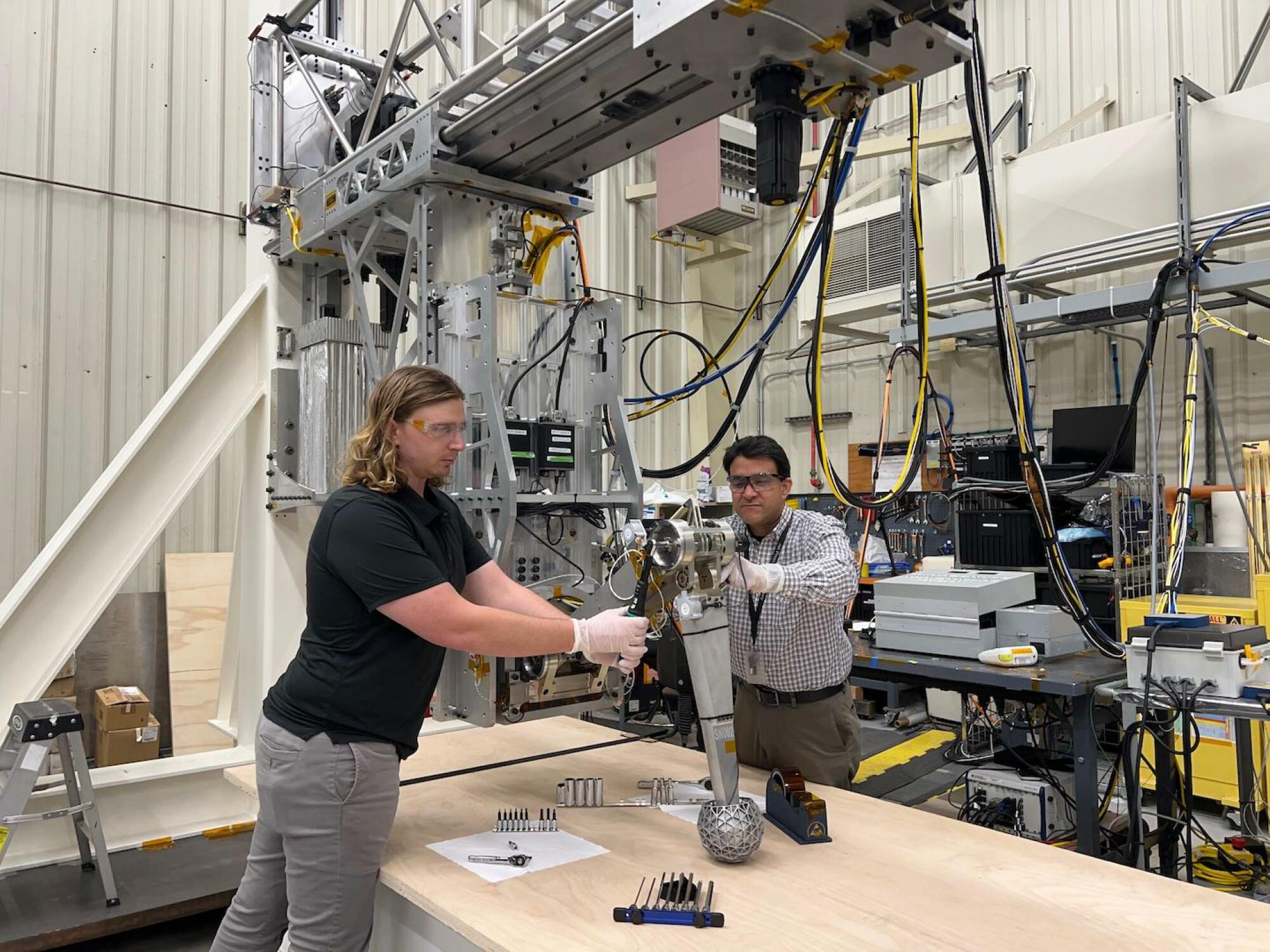 NASA engineers working on the craft's landing system.