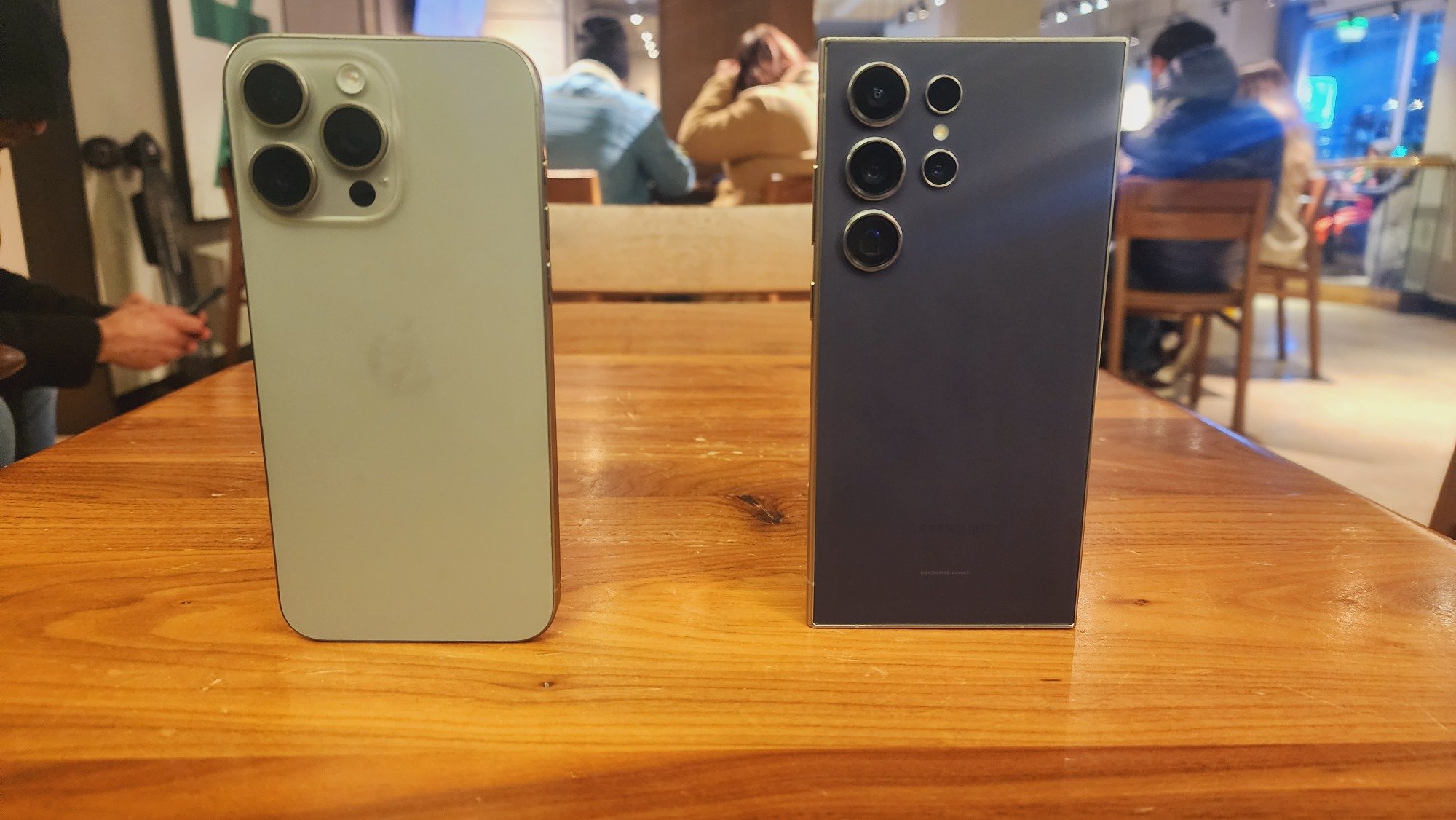Galaxy S24 Ultra and iPhone 15 Pro Max on a table