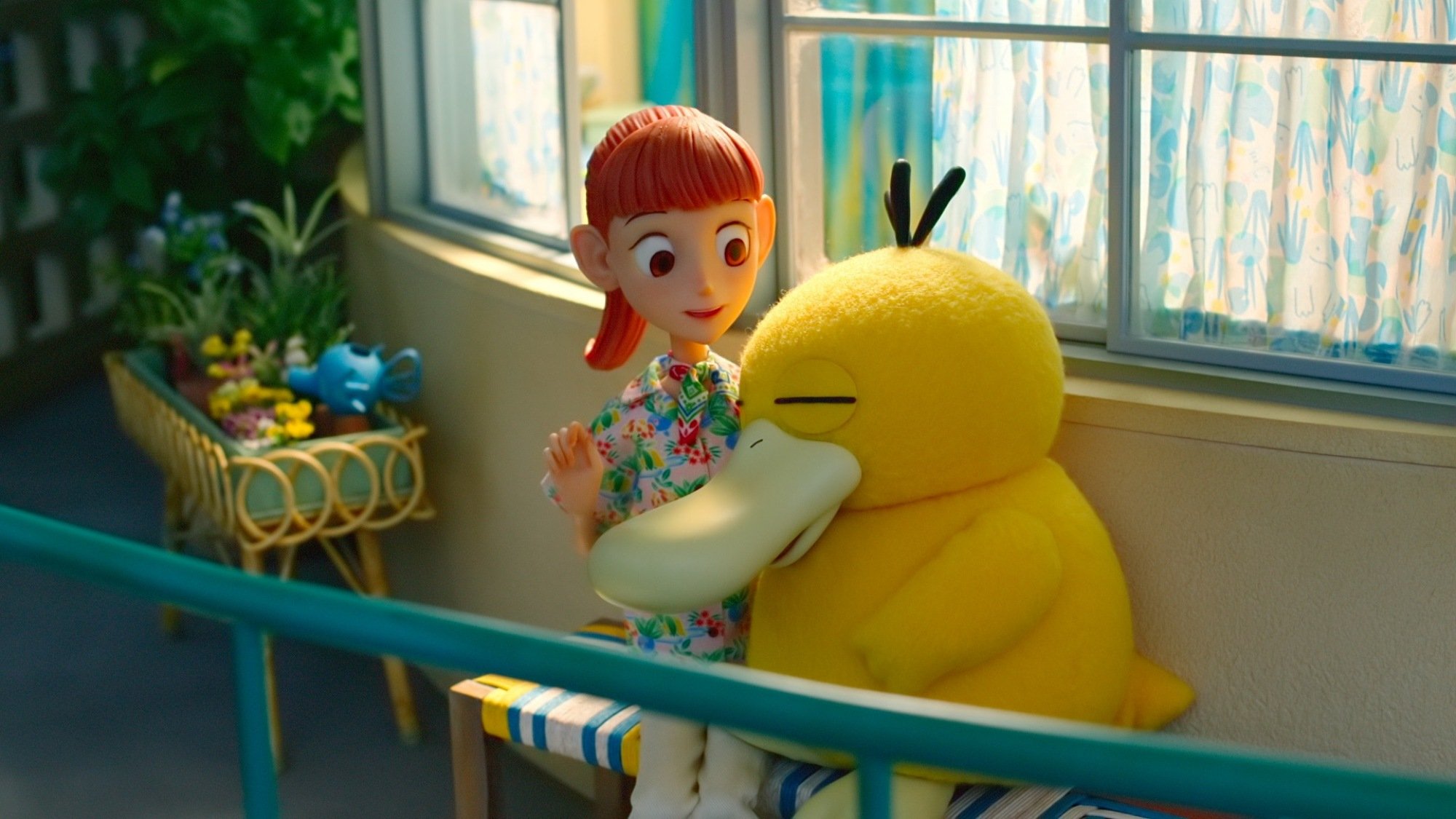 Psyduck nestles into Haru on a resort balcony.