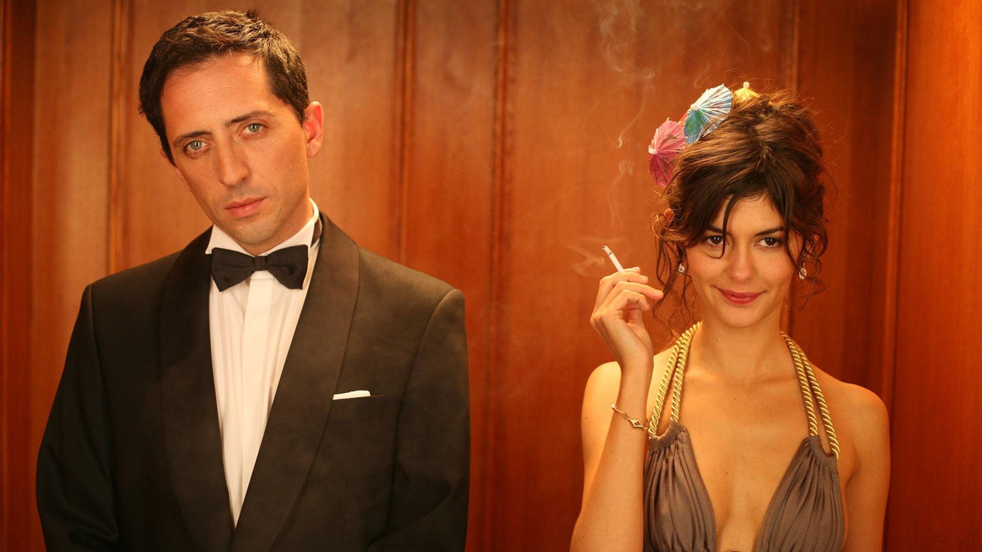 A sharply dressed man and woman in a hotel elevator: Gad Elmaleh and Audrey Tautou in "Priceless."
