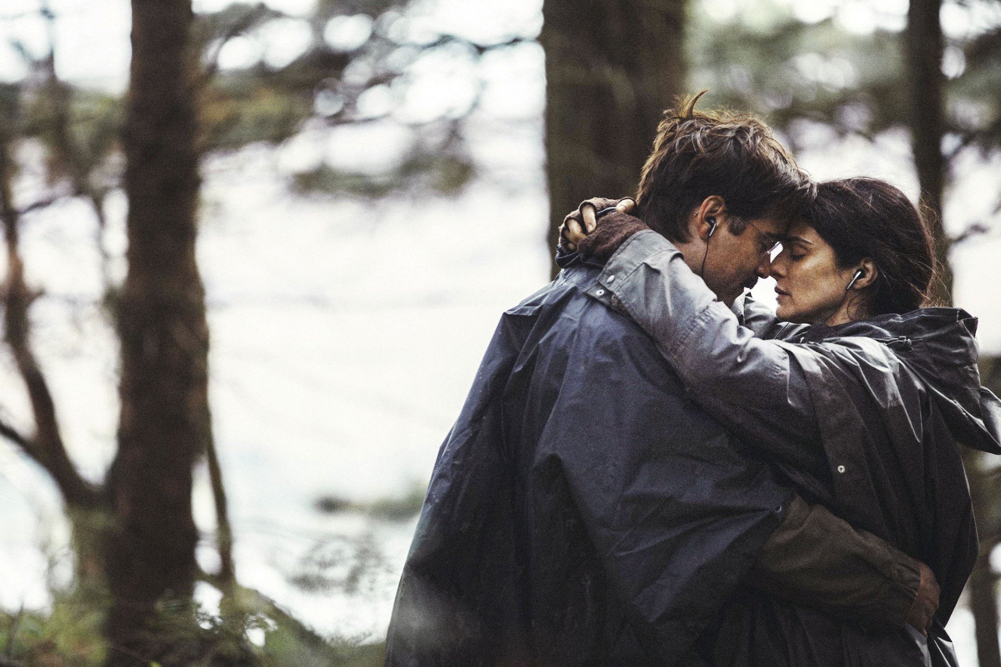 Colin Farrell and Rachel Weisz embrace in a forest in "The Lobster."