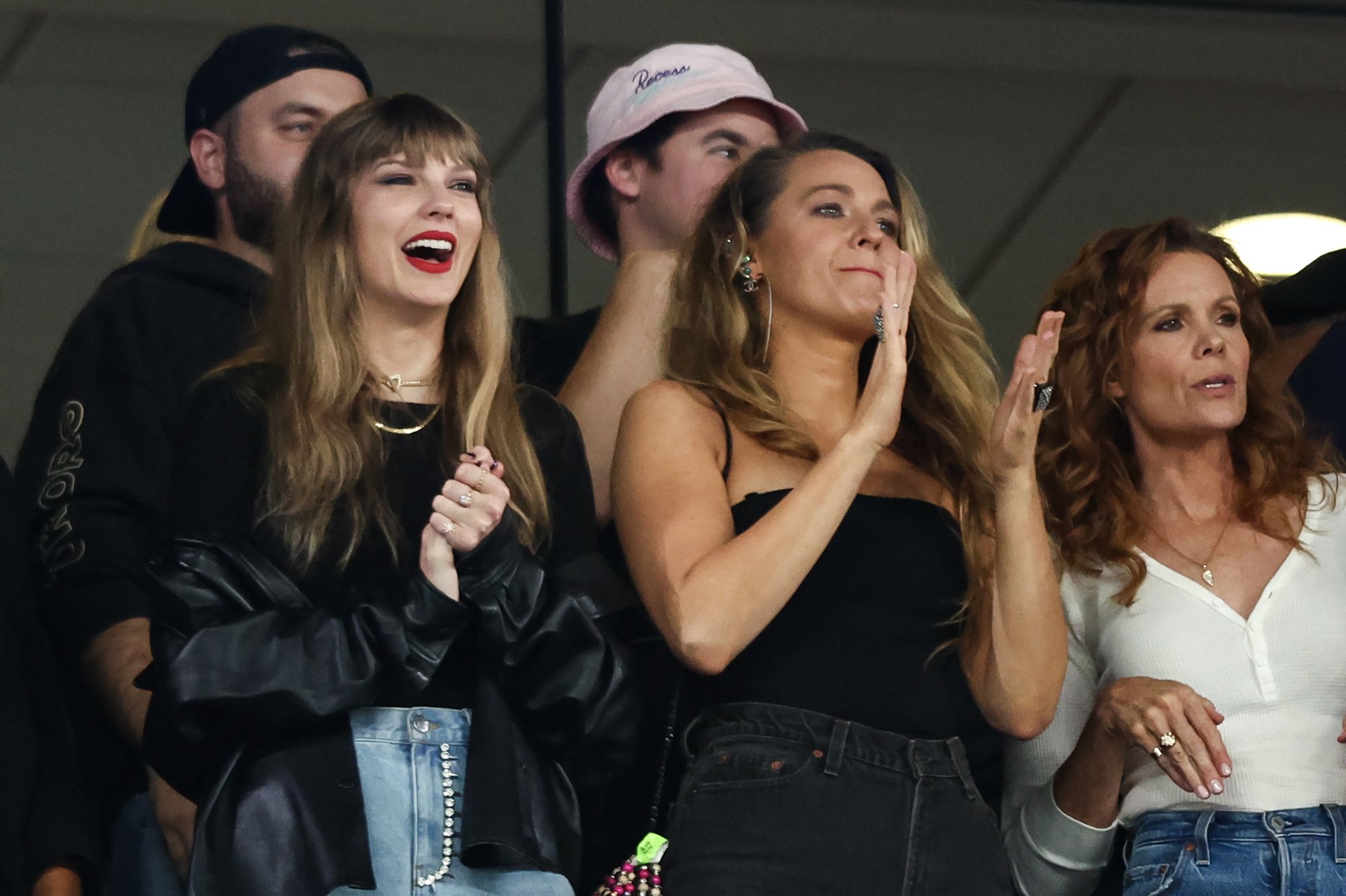 Taylor Swift and Blake Lively dressed in black at the Kansas City Chiefs versus New York Jets game.