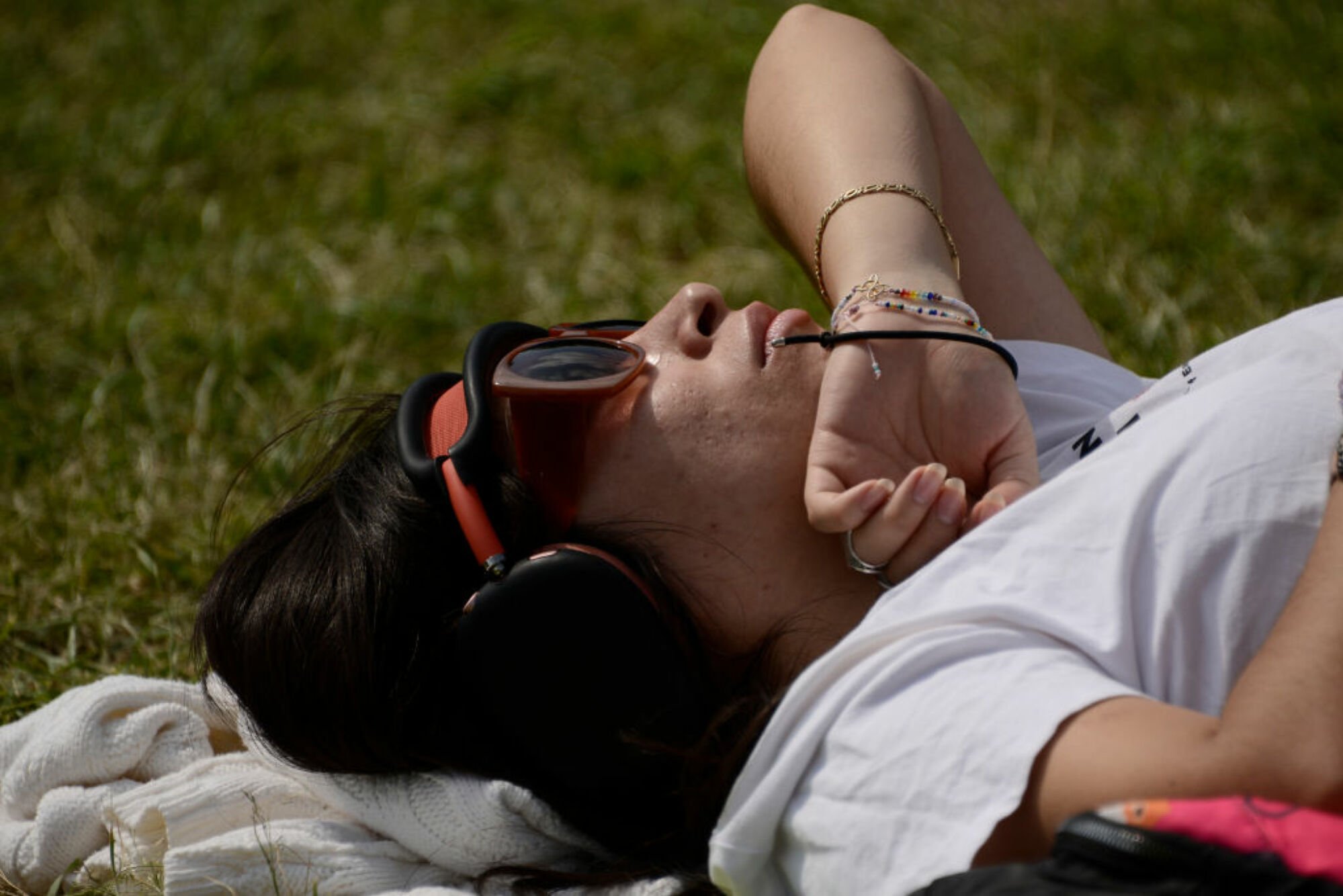 Woman viewing a solar eclipse through protective glasses