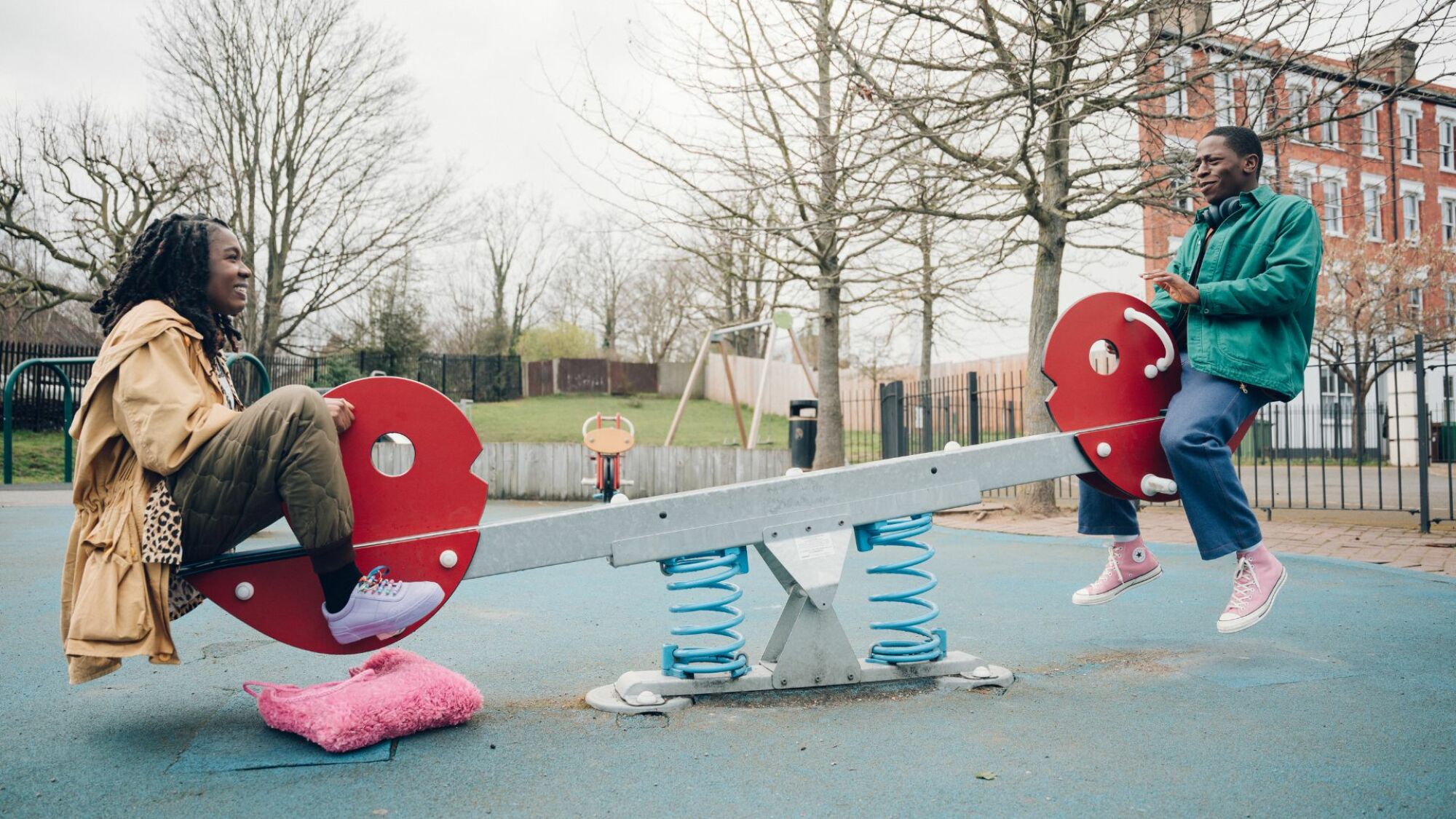 David Jonsson and Vivian Oparah play on a seesaw in "Rye Lane."