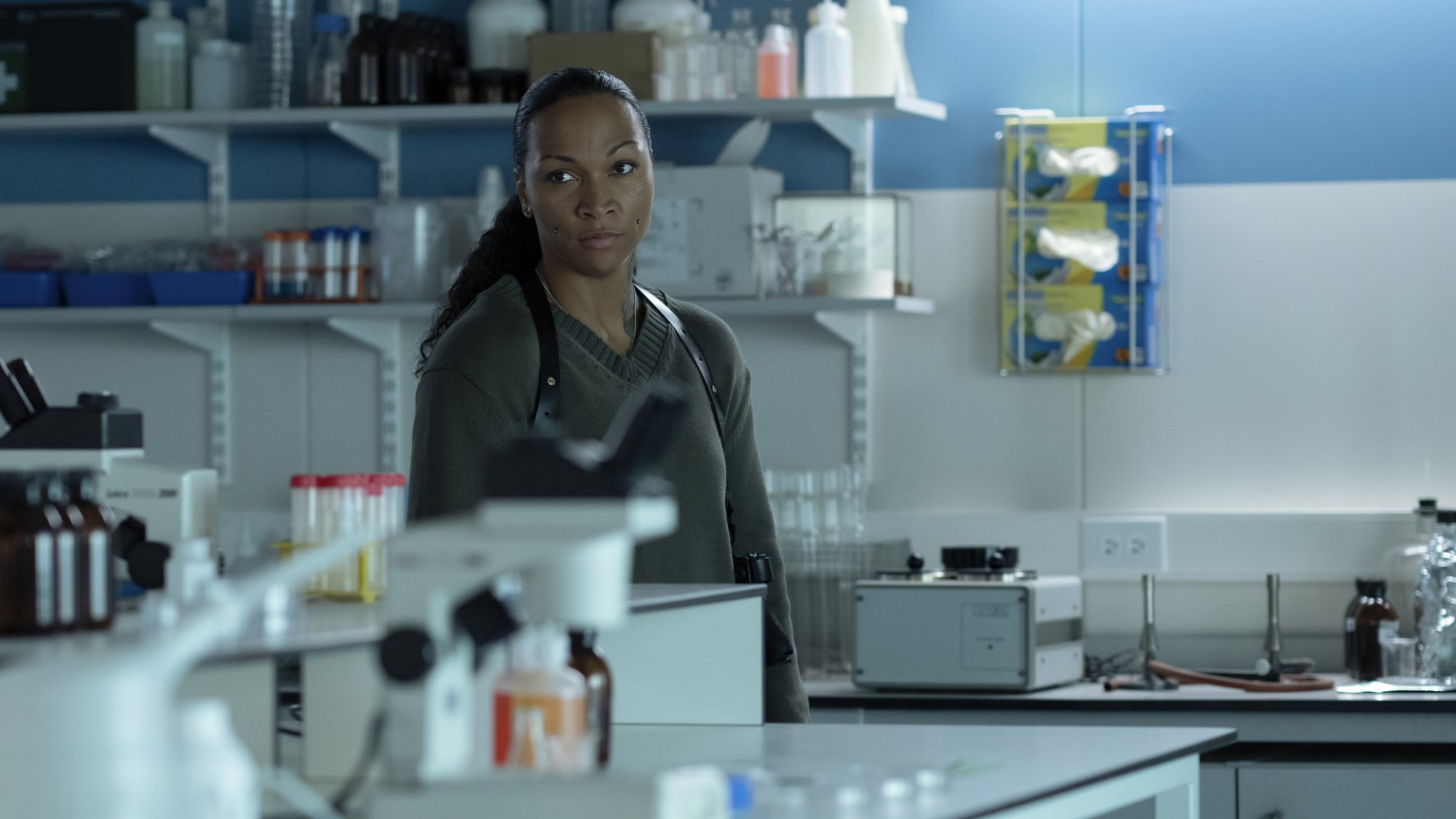 Kali Reis stands in a facility lab.