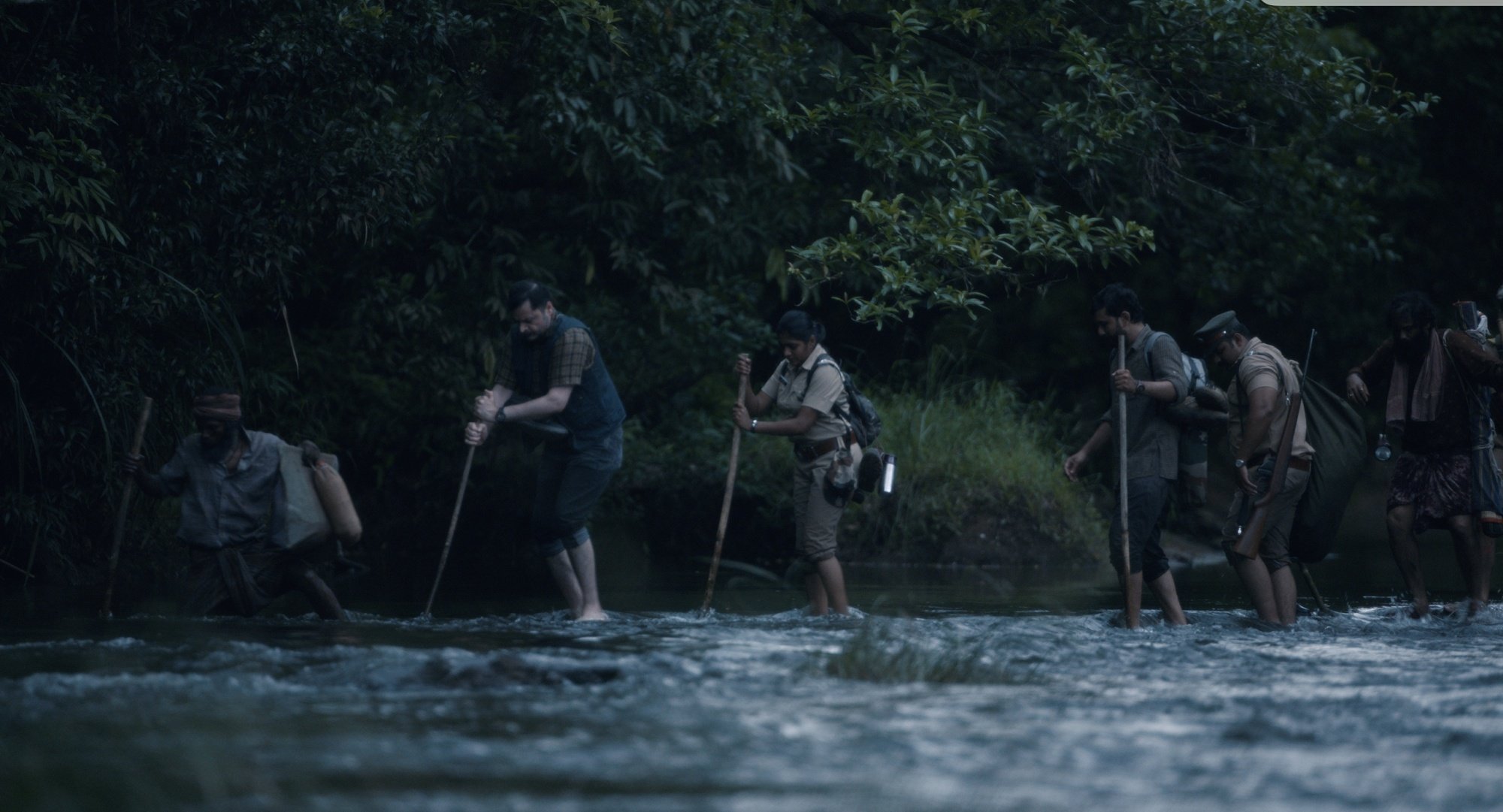 A group of people crossed over a river.