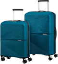 two turquoise suitcases on a white background