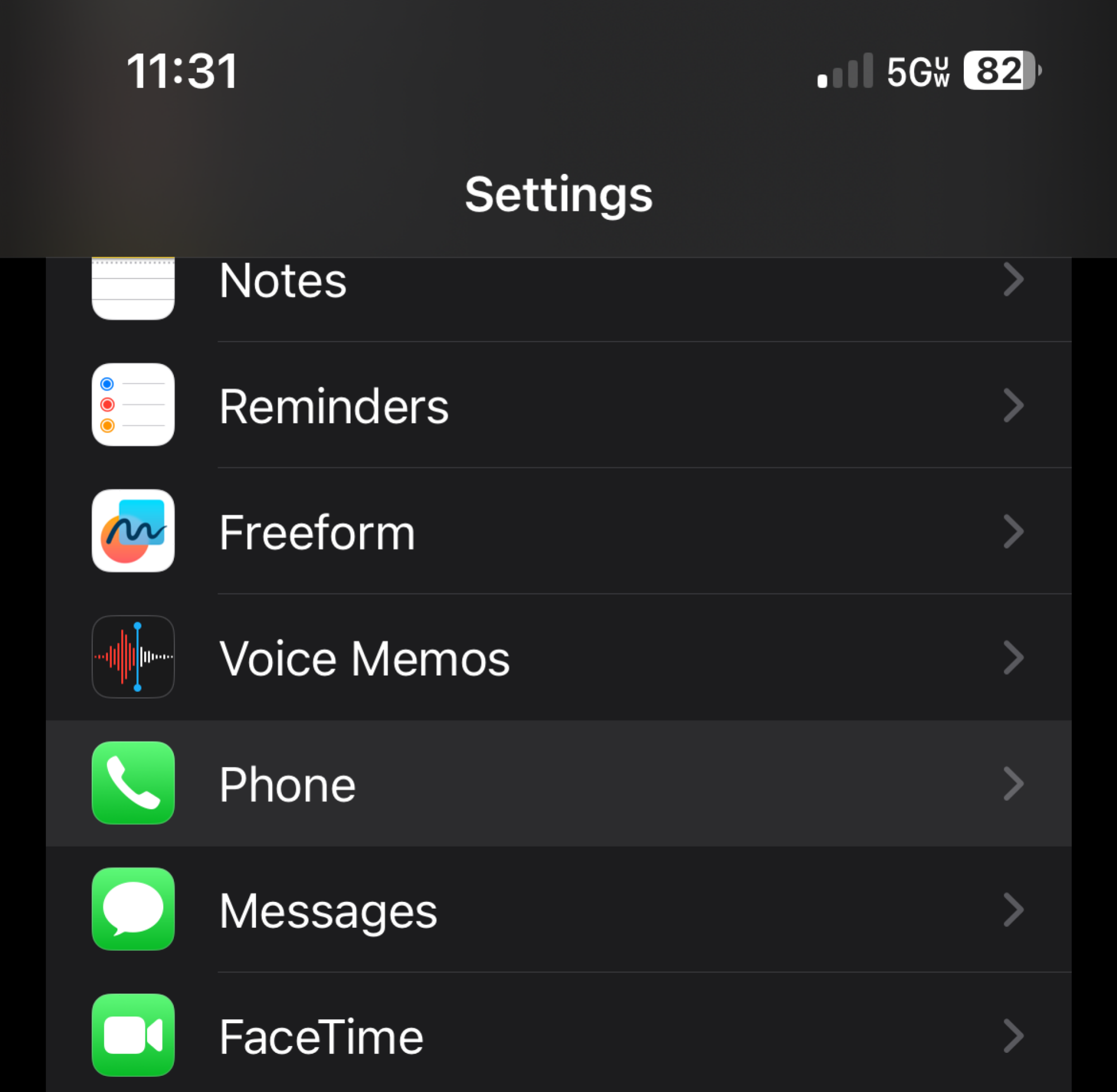 an iPhone 'Settings' menu with 'Phone' highlighted