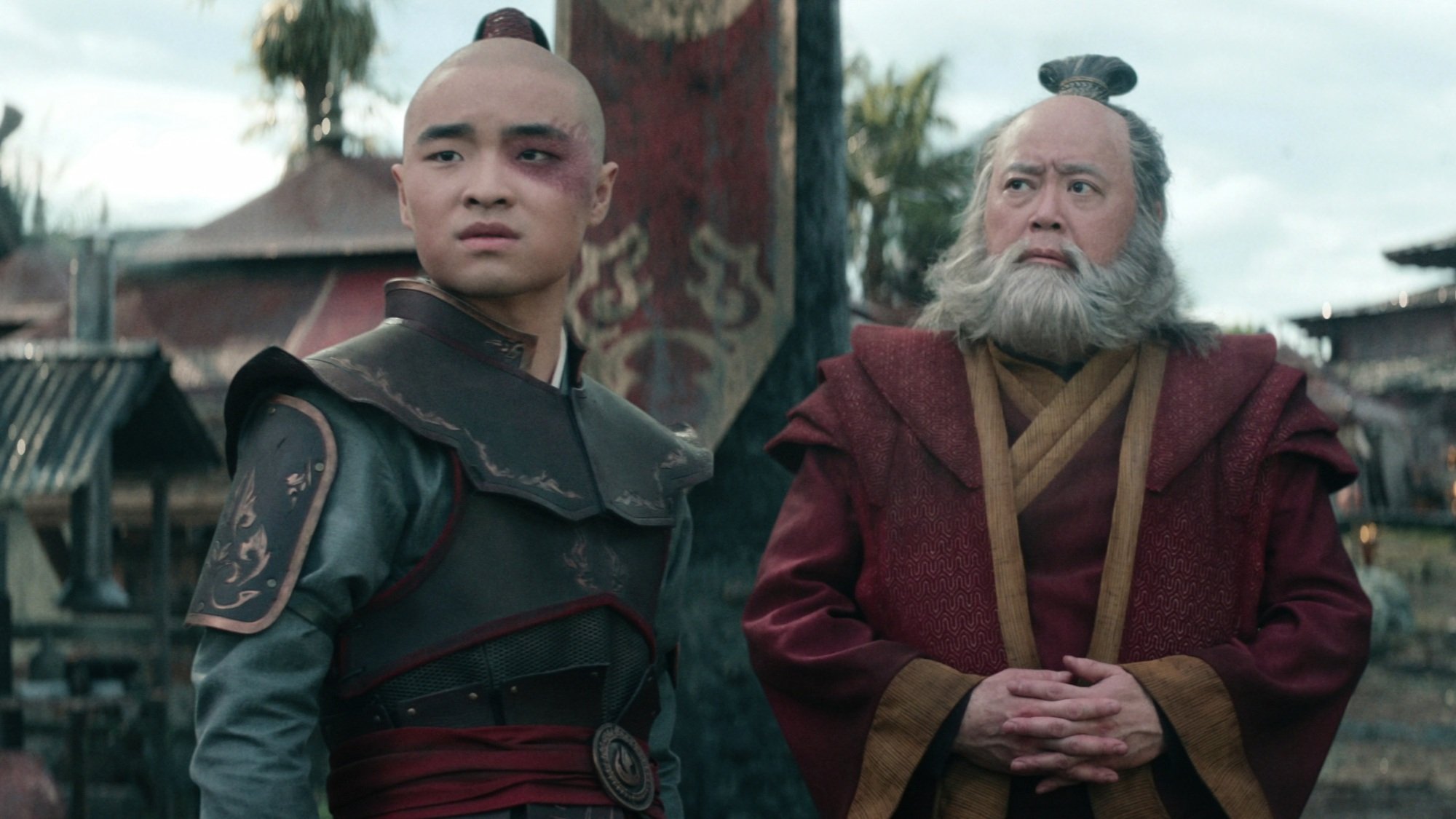 Zuko and Iroh entering an Earth Kingdom village.