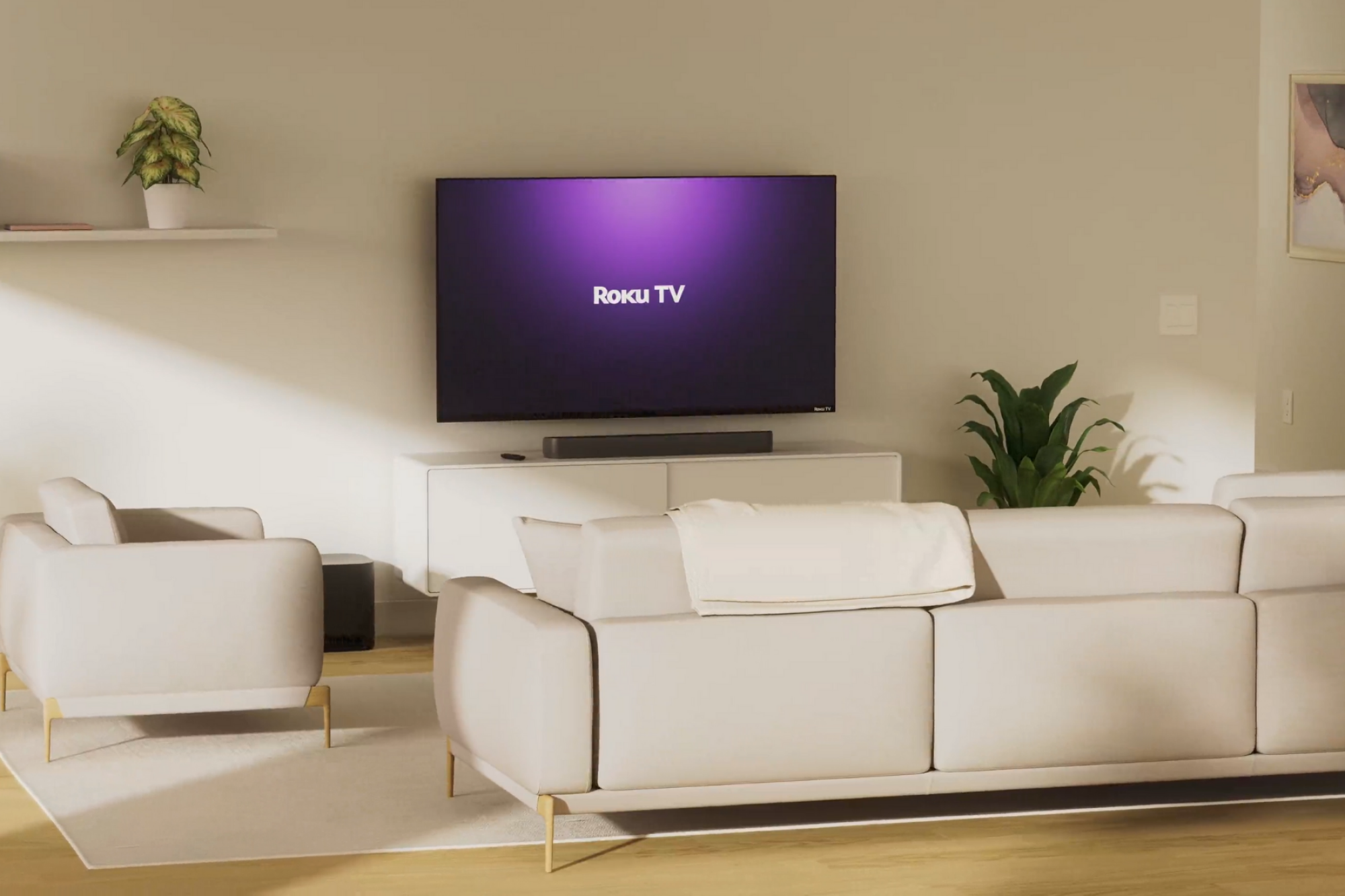 Roku TV hanging on wall beside shelf with furniture in foreground