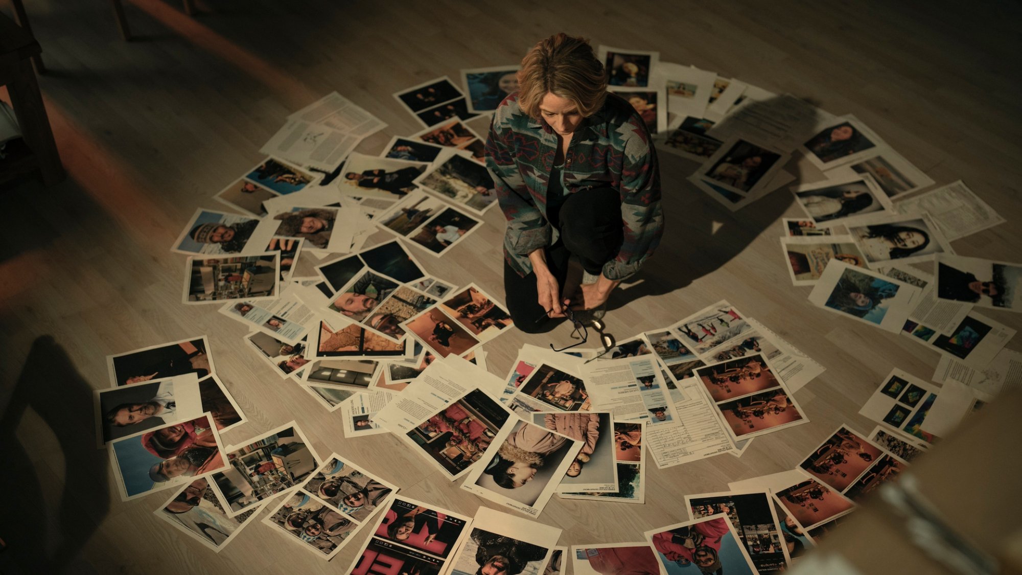 A police chief sits in a ring of evidence.