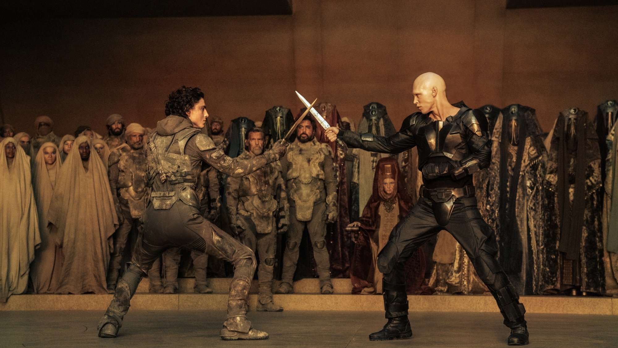Paul Atreides and Feyd-Rautha Harkonnen cross blades before a duel.