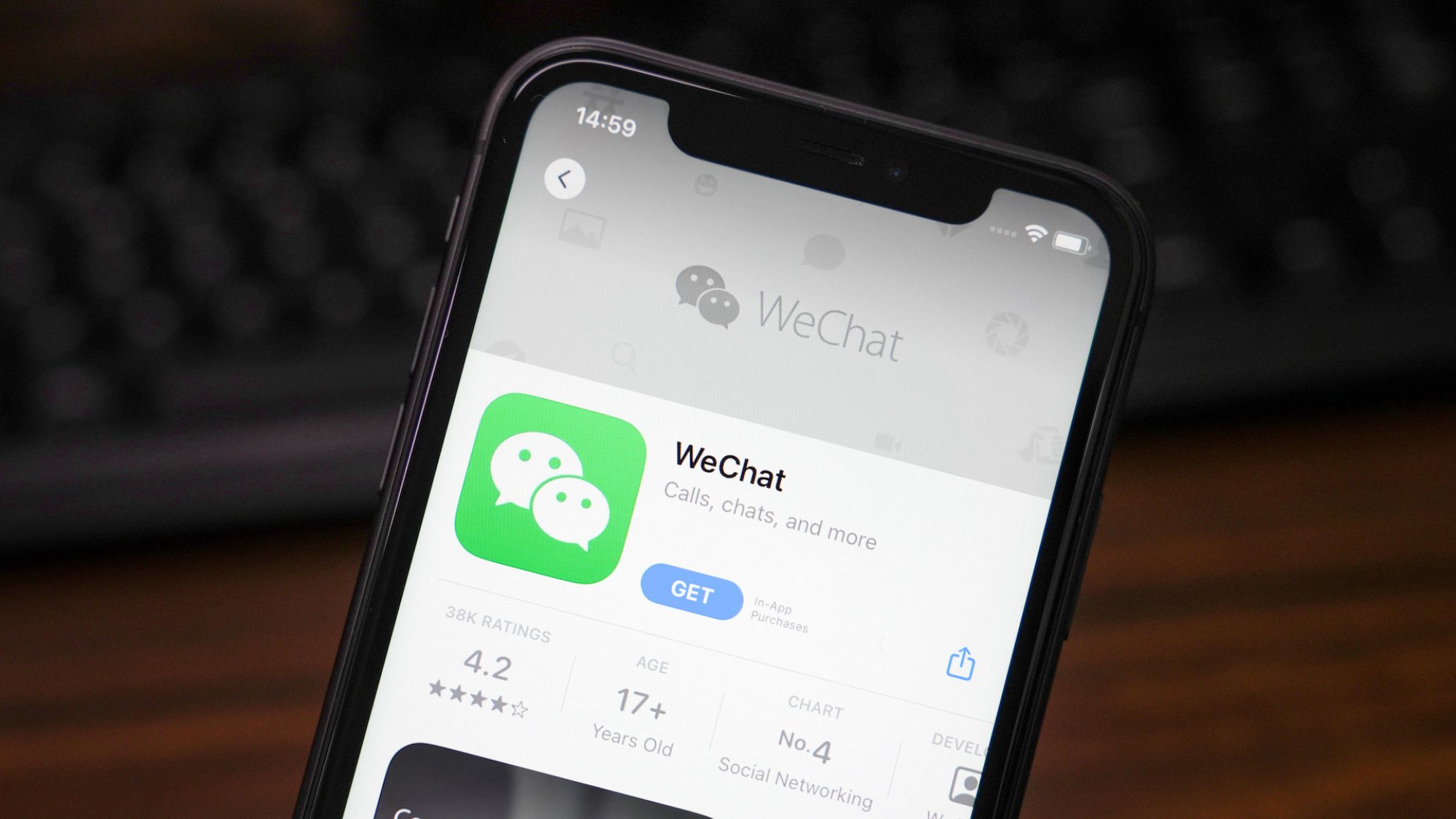 In this photo illustration, the WeChat app is displayed in the App Store on an iPhone.