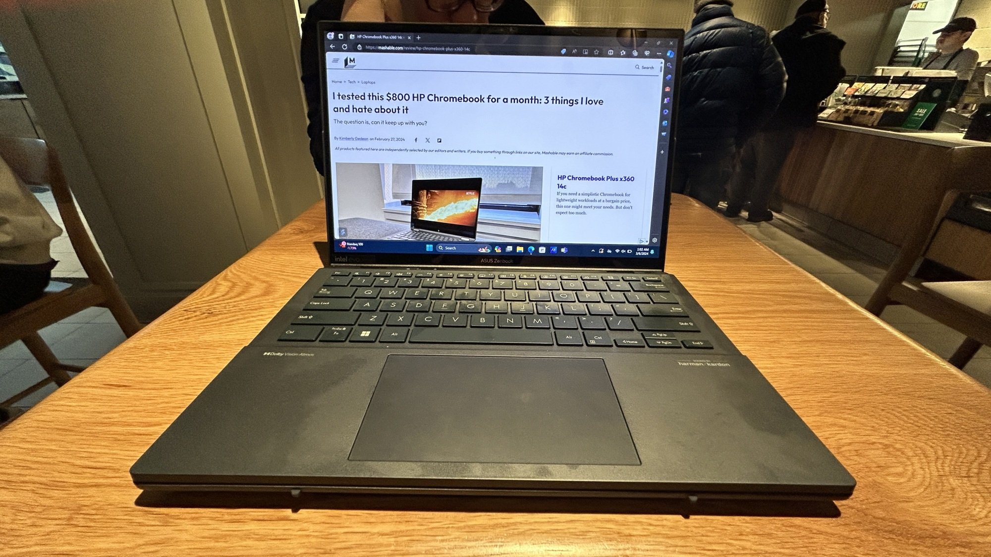 Asus Zenbook Duo in clamshell mode on a table