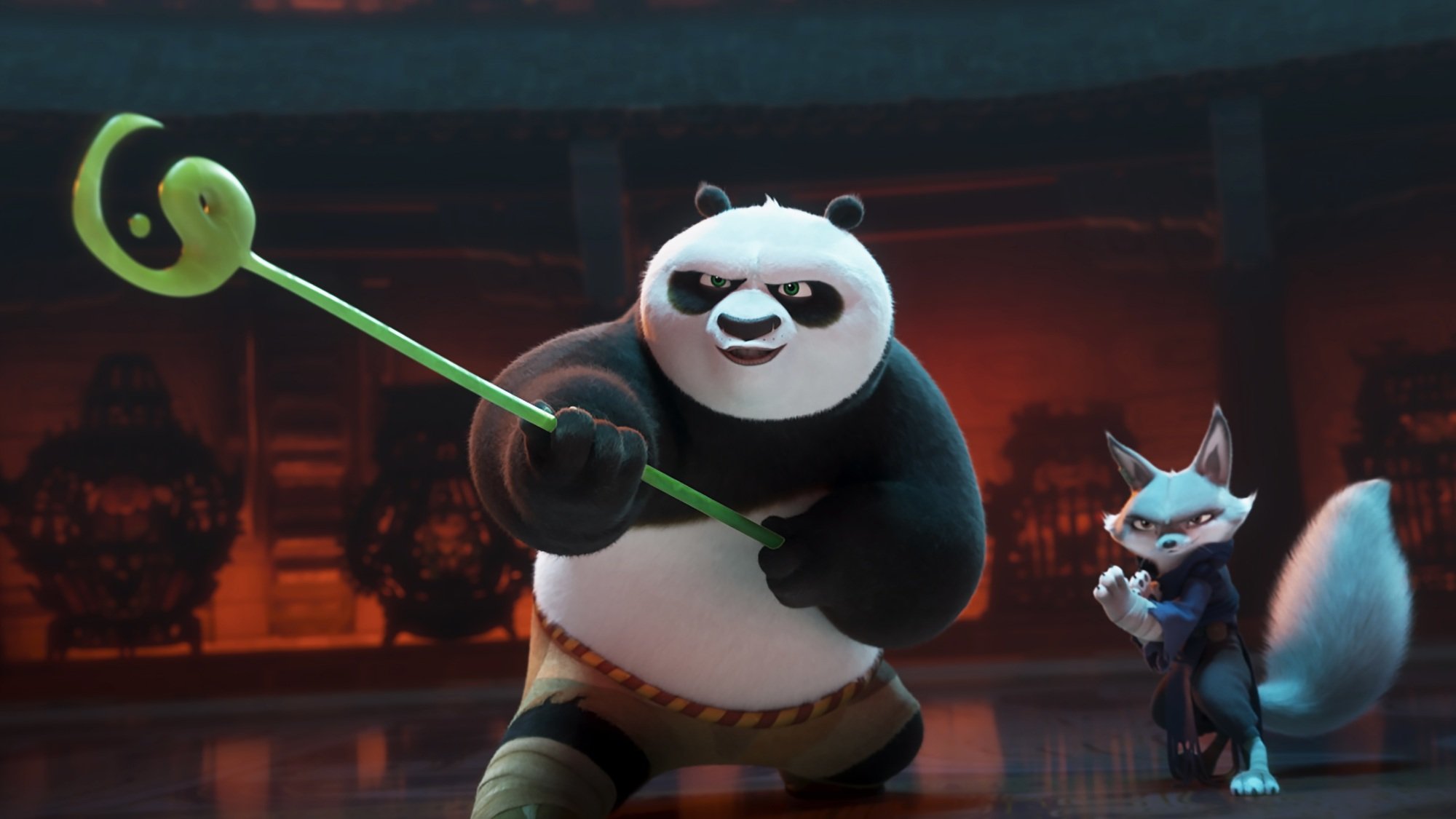 A panda wielding a green staff and a fox prepare to fight.