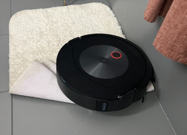 Roomba stuck on corner of white bath mat