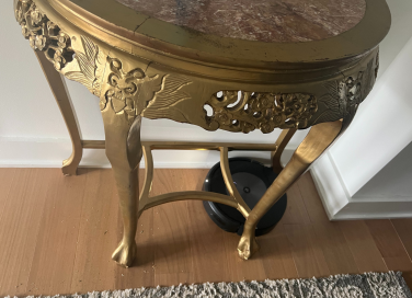 Roomba cleaning around table legs on hardwood floor