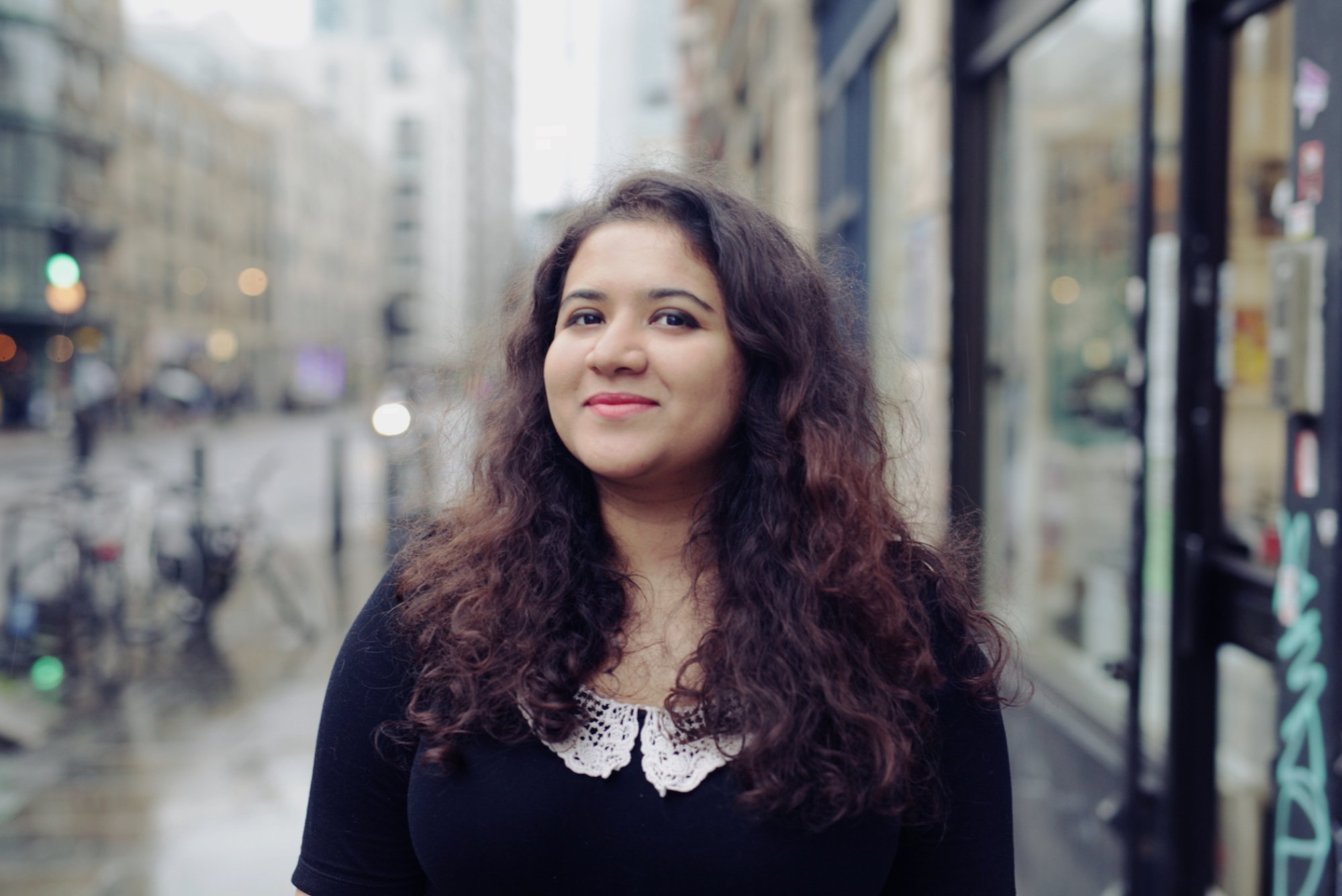 Hera Hussain, founder of Chayn, stands in a street in the UK.
