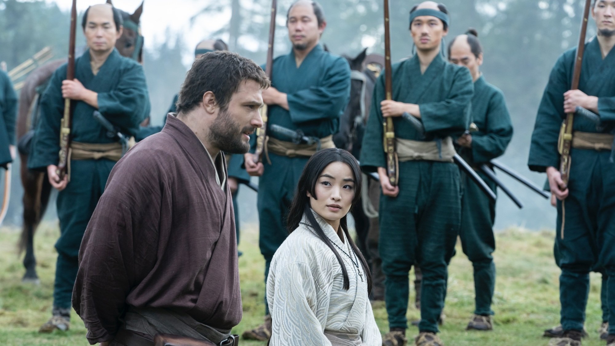 John Blackthorne and Toda Mariko speak during an army training exercise.