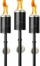 three solo stove tiki torches are lit with flame on a white background