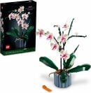a lego orchid plant with its box sitting behind it on a white background
