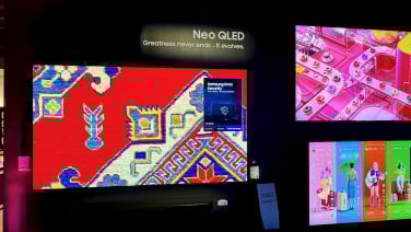 samsung qled tvs on wall