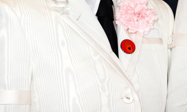 Why celebs are donning red buttons for the red carpet