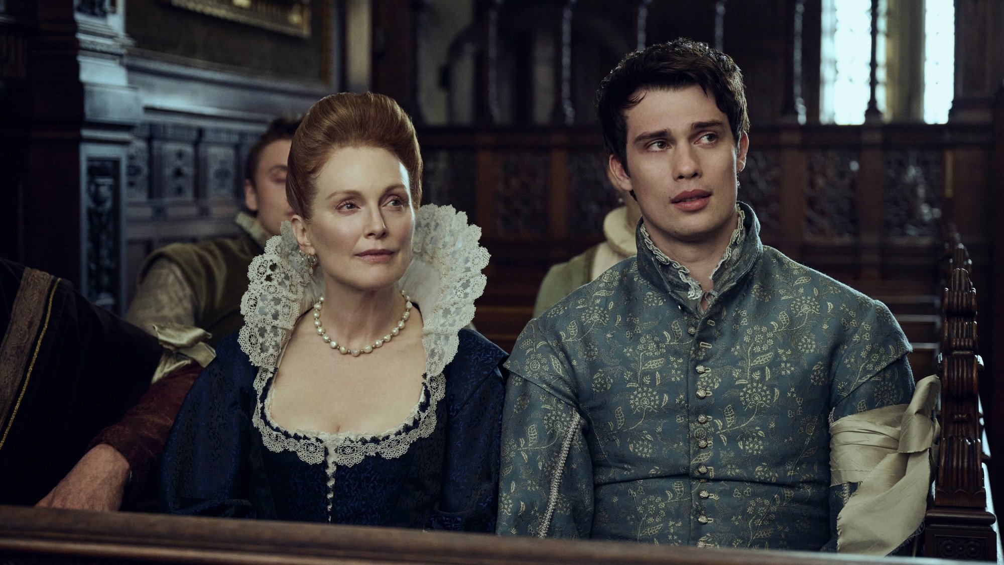 Mary and George Villiers sitting on a wooden bench.