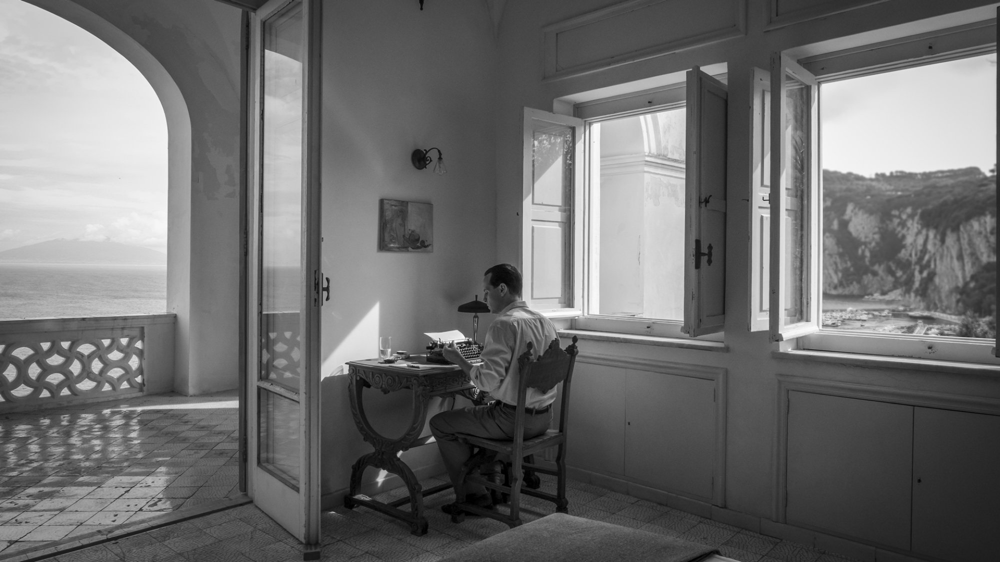 A man at a typewriter. 