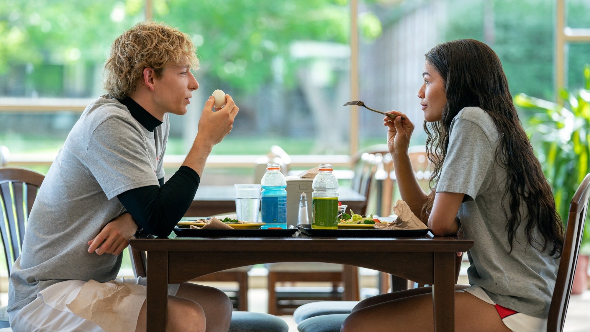Mike Faist and Zendaya share a meal in "Challengers."